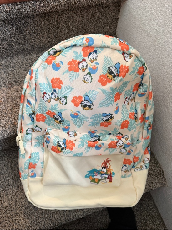 Disney Handbags - This Disney Store backpack features a tropical "Donald Duck .small stain